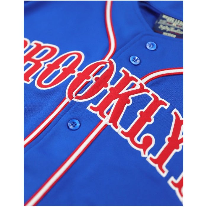 Brooklyn Royal Giants Negro League Baseball Jersey (Front Detail) - Blue baseball jersey with red 'ROOKIE' text on a white background