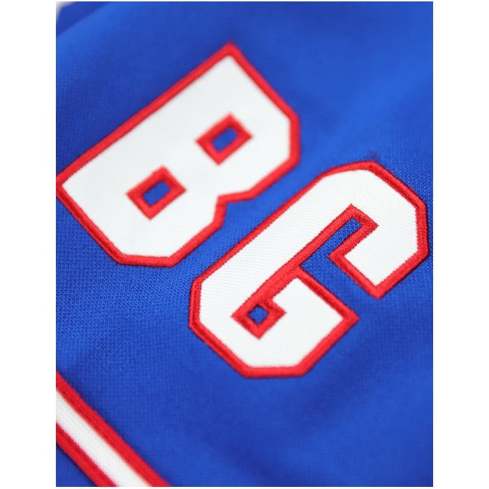 Brooklyn Royal Giants Negro League Baseball Jersey (Sleeve Detail) - Close-up of a blue sports jersey with red and white numbers '86'.