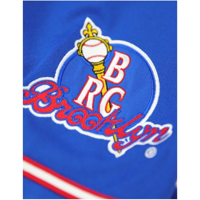8 of 8: Brooklyn Royal Giants Negro League Baseball Jersey (Sleeve Detail) - Close-up of a blue sports jersey with 'BROOKLYN' and 'BRG' branding.