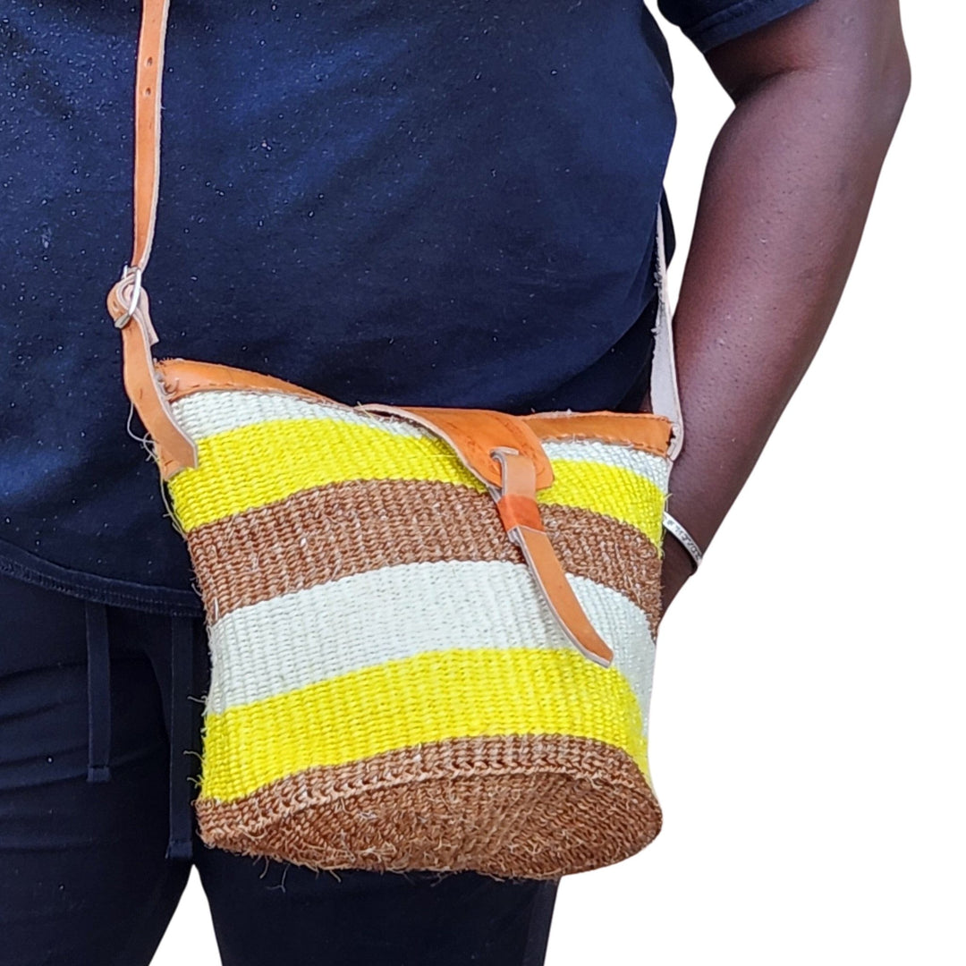 Nanyori: Authentic Hand Woven Sisal and Leather Kenyan Kiondo (Lifestyle View 2 - Brown, Yellow and Natural Colors)