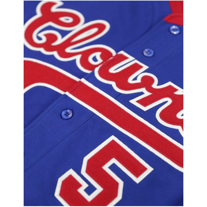 3 of 8: Hank Aaron: Indianapolis Clowns Heritage Baeball Jersey - Blue baseball jersey with red accents and 'Clowns' text on a white background (Front Detail)