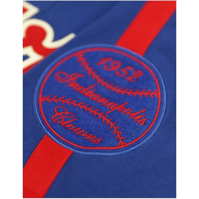 7 of 8: Hank Aaron: Indianapolis Clowns Heritage Baeball Jersey - Blue baseball jersey with red accents and 'Clowns' text on a white background (Sleeve Detail)