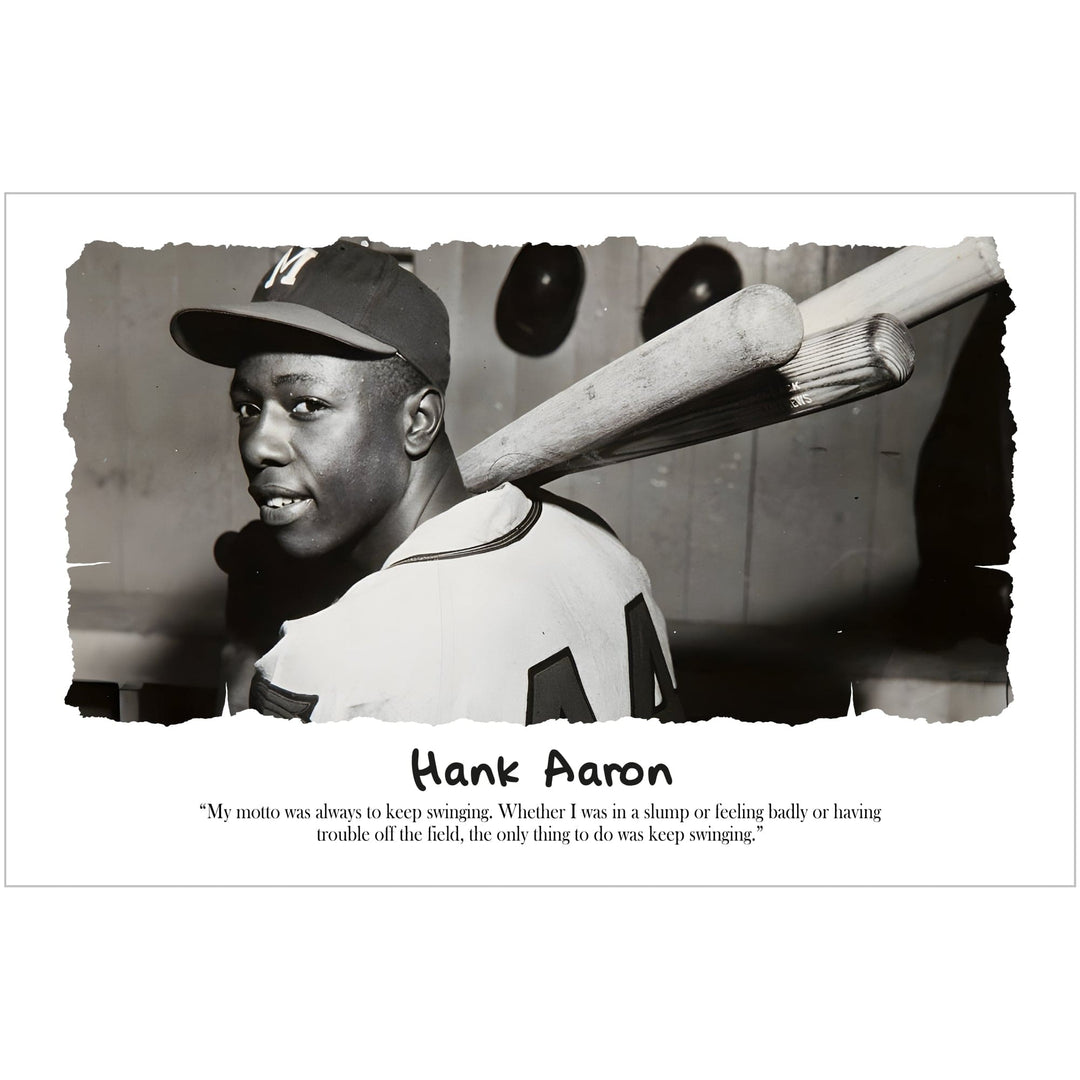 Hank Aaron: Keep Swingin' by Sankofa Designs - Black and white photo of Hank Aaron with bats, featuring a quote about maintaining determination. (Unframed)
