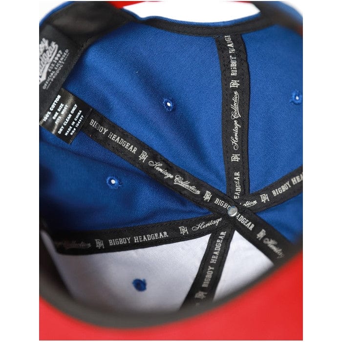 Indianapolis Clowns Heritage Cotton Snapback Baseball Cap - Close-up of a blue cap with black branding on a red background (Inside Detail)