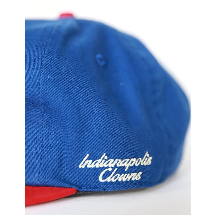 Indianapolis Clowns Heritage Cotton Snapback Baseball Cap- Blue cap with 'Indianapolis Clowns' text on a white background (Side Detail)