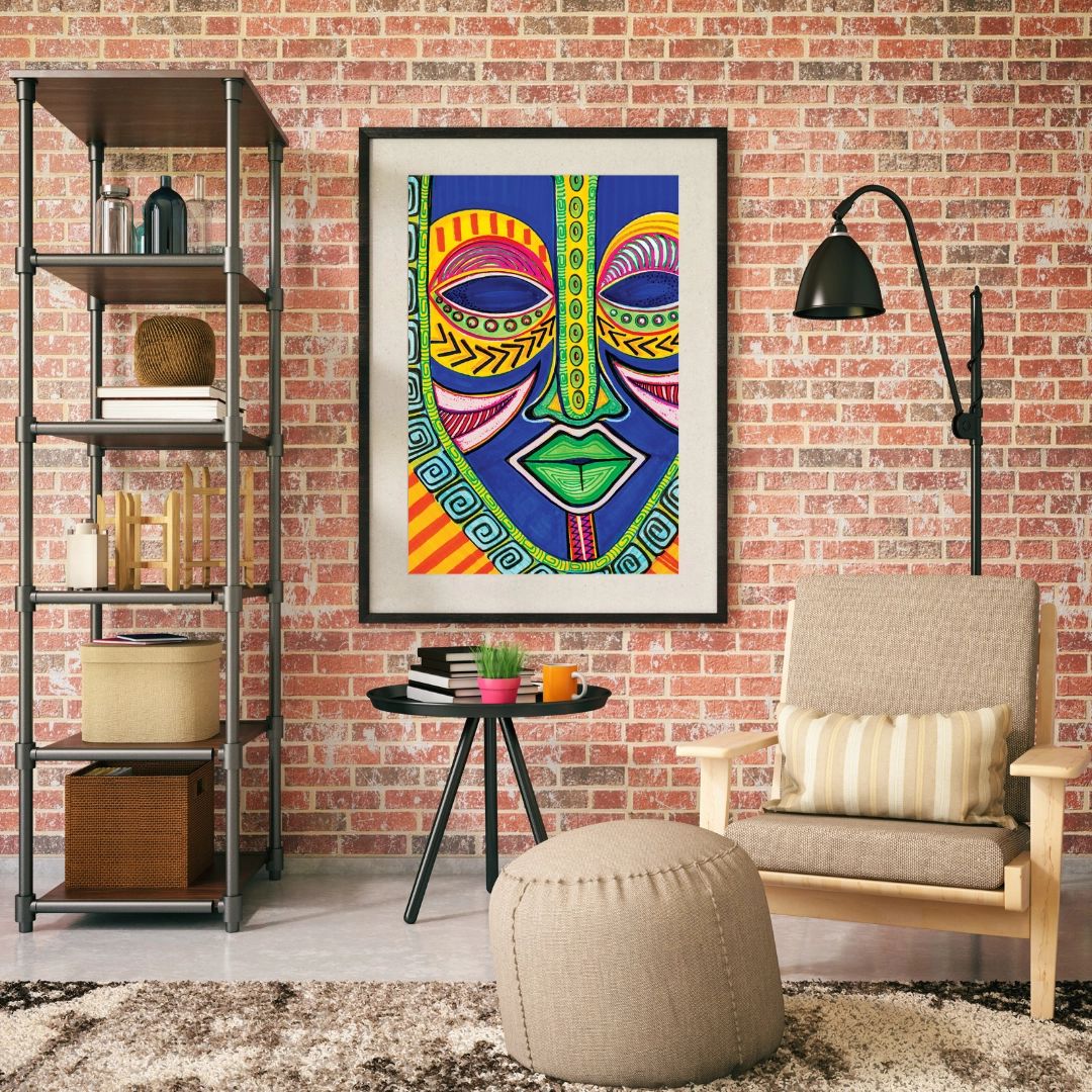Inspire by Sylvia "Gbaby" Cohen: African American Jigsaw Puzzle (Framed Puzzle) - Living room with a colorful mask artwork on a brick wall, bookshelf, and chair.