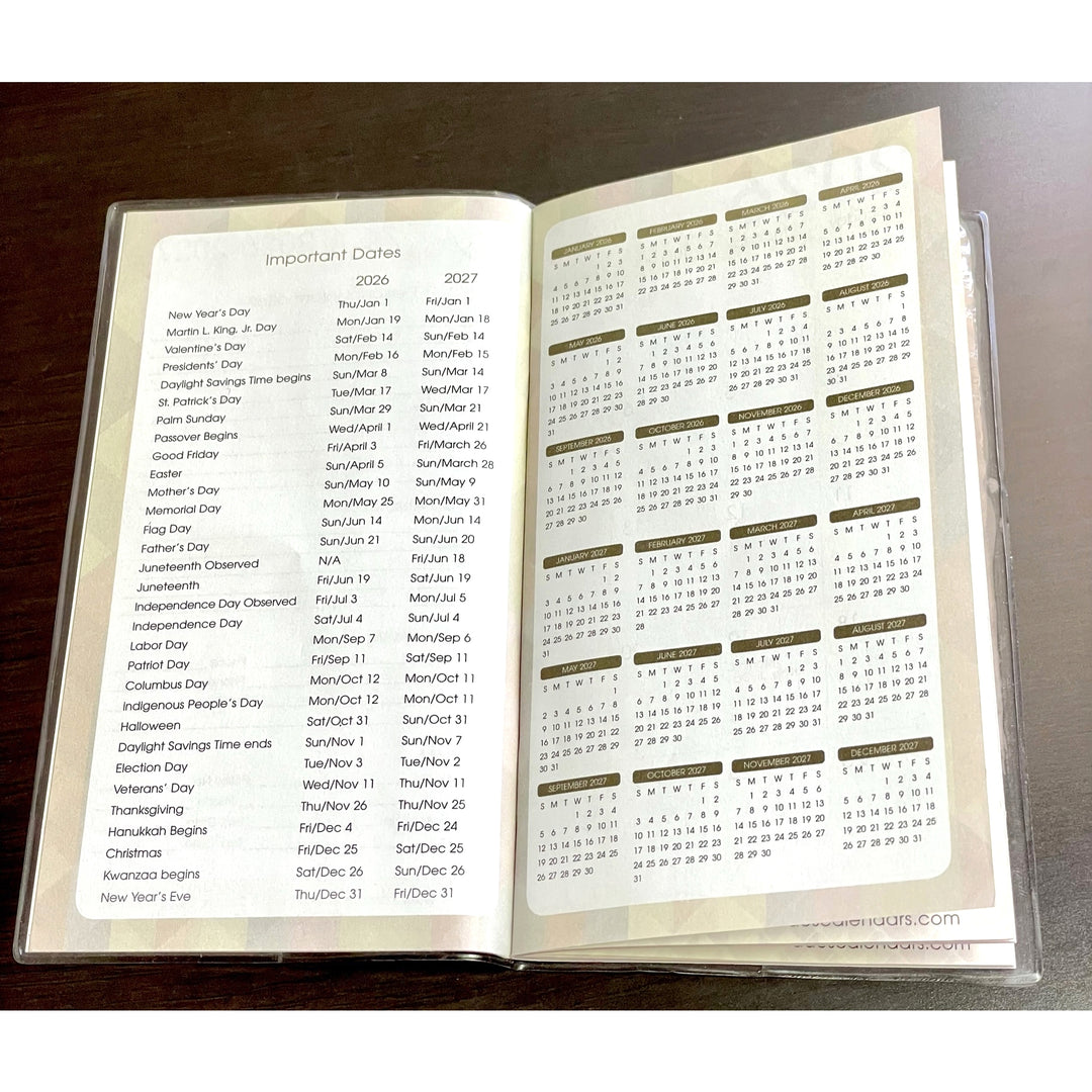 Blessed by the Best (Ivy Edition): 2026-2027 Two Year Planner (Important Dates) - Open book with calendar and list of important dates on a wooden surface