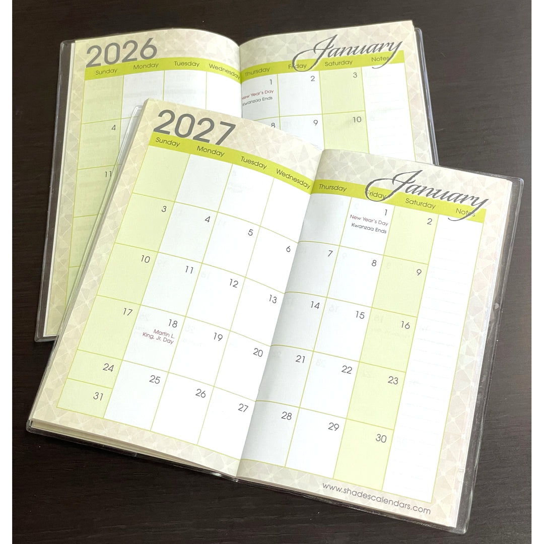 I Am Radiant by Sylvia "Gbaby" Cohen: 2026-2027 Two Year African American Pocket Planner (Monthly View) - Two open calendars for 2026 and 2027 on a dark surface