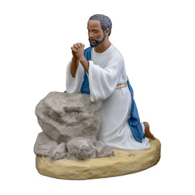 African American Jesus Praying in the Garden Figurine (Main) - Statue of a man in a white robe and blue cloak kneeling by a rock formation on a white background