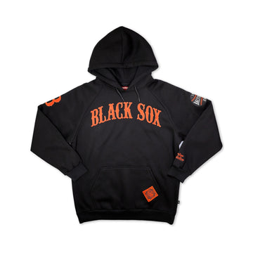 Baltimore Black Sox Heritage Hooded Sweatshirt (Main) - A black pullover hoodie featuring 'BLACK SOX' printed in orange arched block letters across the chest, with additional orange and white graphic details on the sleeves and a small orange patch on the front pocket, shown against a plain white background.