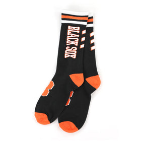 Baltimore Black Sox Knitted Socks (Main) - A pair of black crew socks with orange and white accents, featuring the text 'BLACK SOX' printed vertically on one sock, displayed against a plain white background.