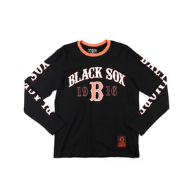 Baltimore Black Sox Long Sleeve T-Shirt (Main) - A black long-sleeve t-shirt with 'BLACK SOX 1916' printed in white and orange on the front, featuring 'DUALITY' printed down both sleeves and a small orange logo patch near the bottom hem.