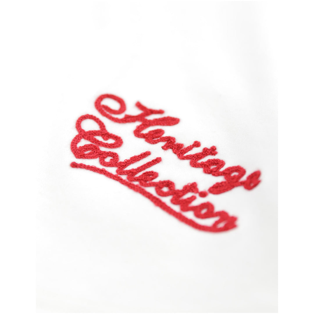 Baltimore Black Sox Negro Leagues Heritage Baseball Jersey (Front Detail 2) - Red embroidered script reading 'Heritage Collection' on a white fabric background.