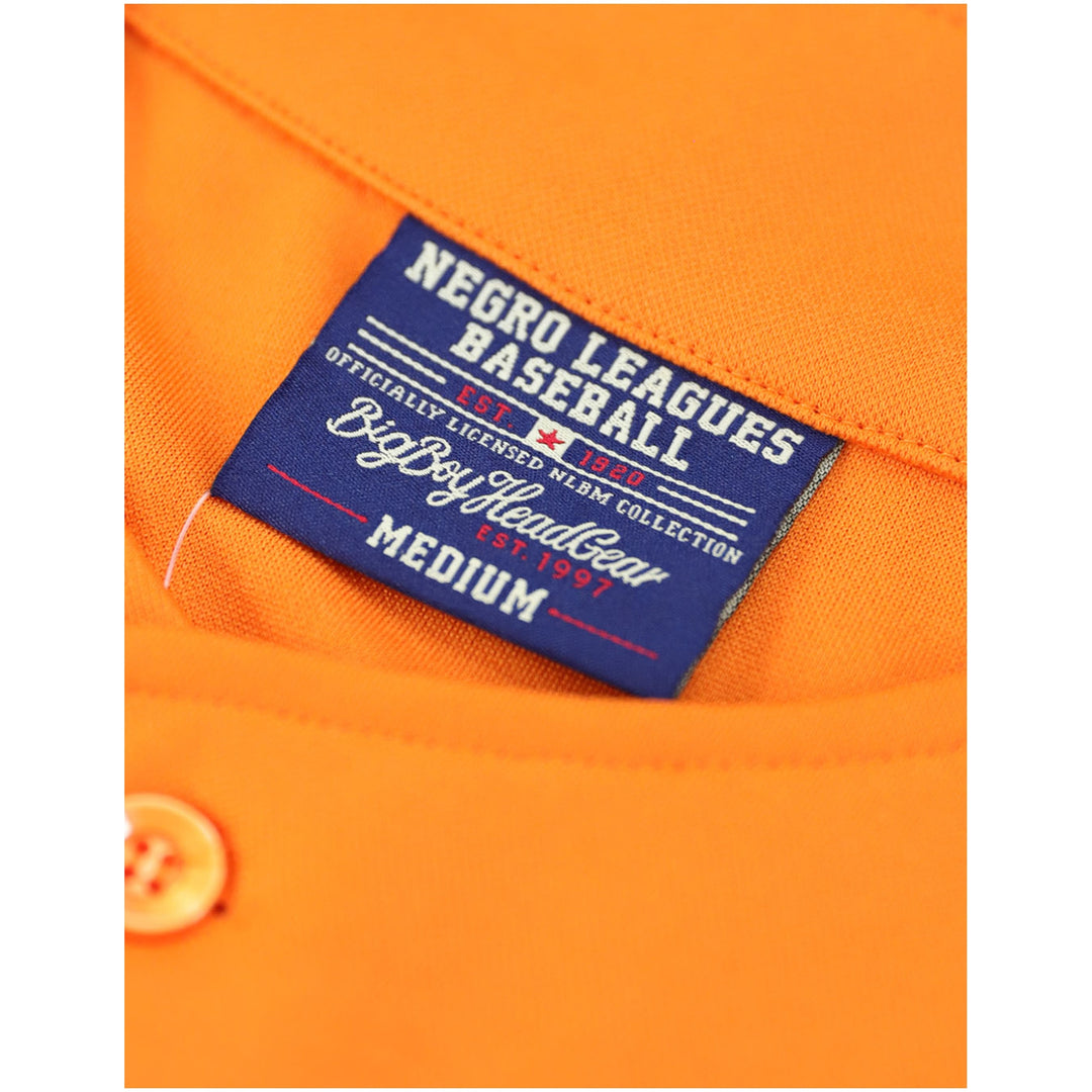 Baltimore Black Sox Legacy Baseball Jersey (Front Detail 3) - Close-up of an orange baseball shirt showing a blue interior neck label that reads 'Negro Leagues Baseball' and 'Big Boy Leather Est. 1967'.
