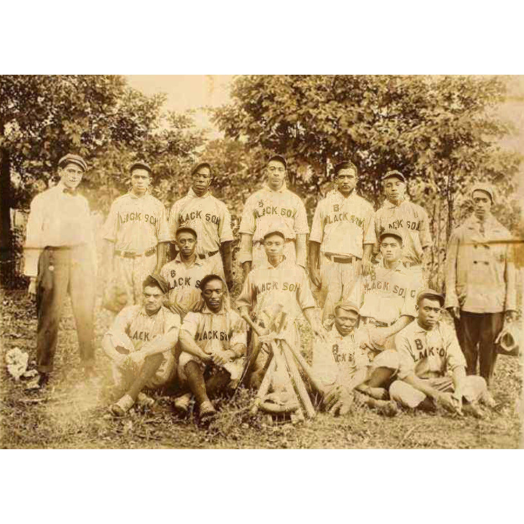 Baltimore Black Sox Team Photo (Late 1910s, Unframed) - Vintage sepia-toned group photograph of a baseball team outdoors, with players wearing 'Black Sox' jerseys and several adults standing beside them among trees.