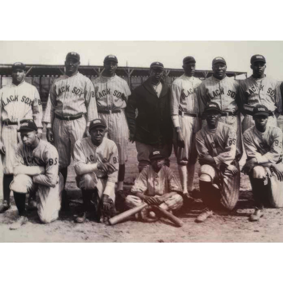 1920s Baltimore Black Sox team in pinstripe uniforms posed before a wooden grandstand