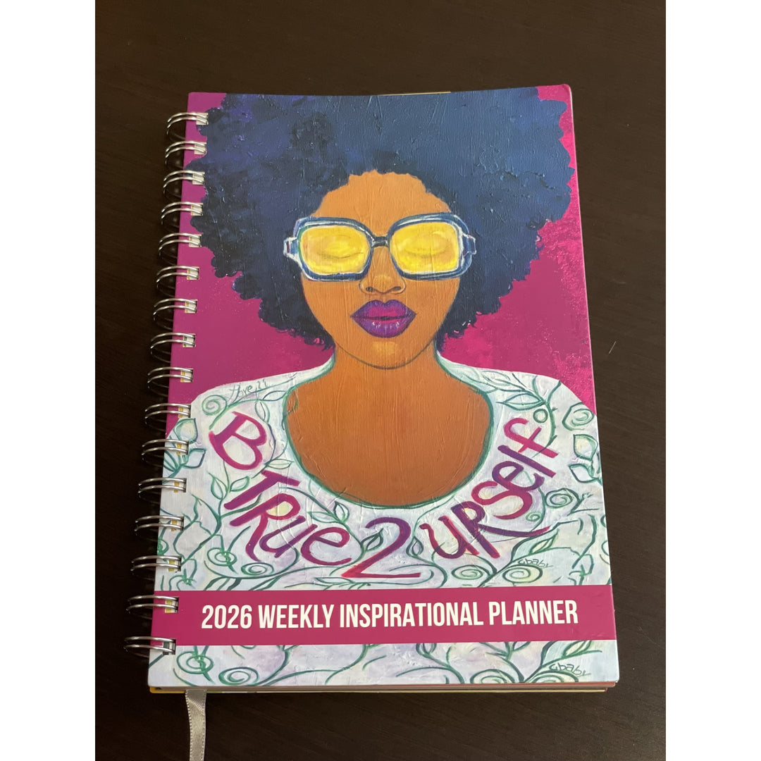Be True to Yourself by Sylvia "Gbaby" Cohen: 2026 African American Weekly Inspirational Planner (Lifestyle Front) - Planner with a colorful cover featuring a woman's face and 'Be True 2 Urself' text on a dark surface.