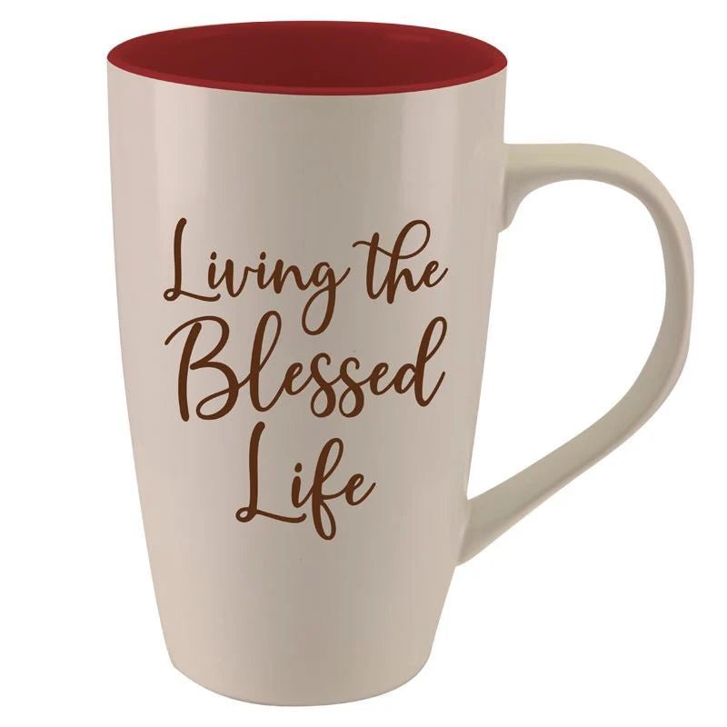 Living the Blessed Life Ceramic Latte Mug by Albert Fennell (Rear) - A cream-colored ceramic mug with a red interior and brown script text reading 'Living the Blessed Life' on the front, set against a plain white background.