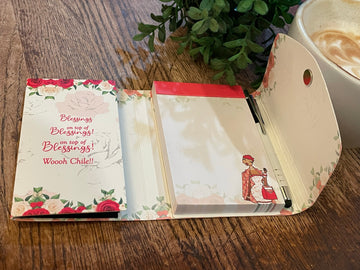 Blessings Upon Blessings (Diva) Stylus Purse Pal by Kiwi McDowell (Interior) - Open notebook with floral design on a wooden surface next to a cup of coffee and plant.