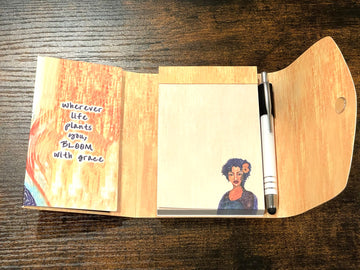 Bloom With Grace: African American Stylus Purse Pal by Sylvia "Gbaby" Cohen (Interior) - Open notebook with a pen on a wooden surface