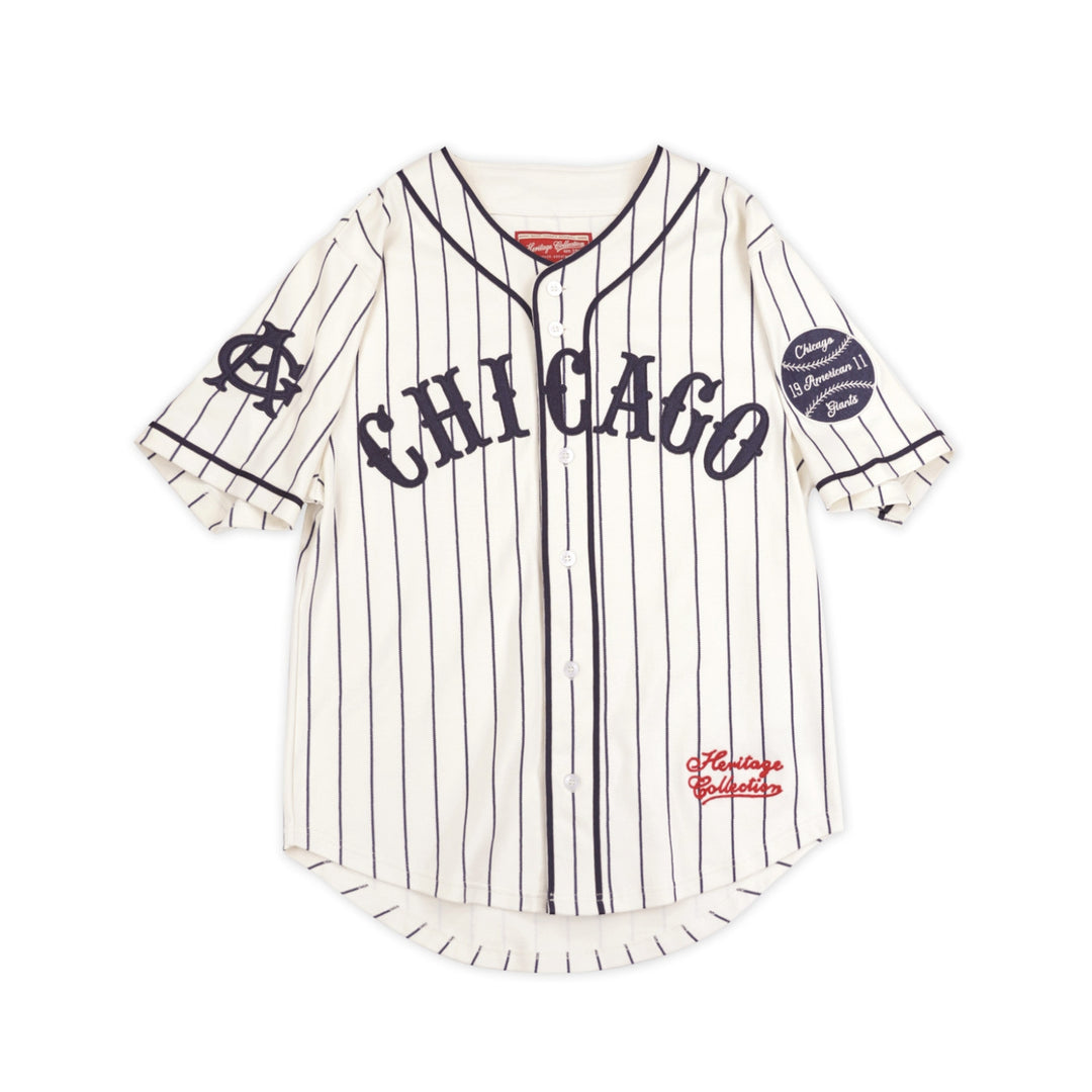 Chicago American Giants Heritage Negro Leagues Baseball Jersey (Main) - A vintage-style Chicago baseball jersey with vertical navy pinstripes on an off-white base. It features 'CHICAGO' arched across the chest in navy, a navy 'C' logo on the right sleeve, a baseball patch on the left sleeve, and 'Heritage Athletics' in red script near the lower left hem.