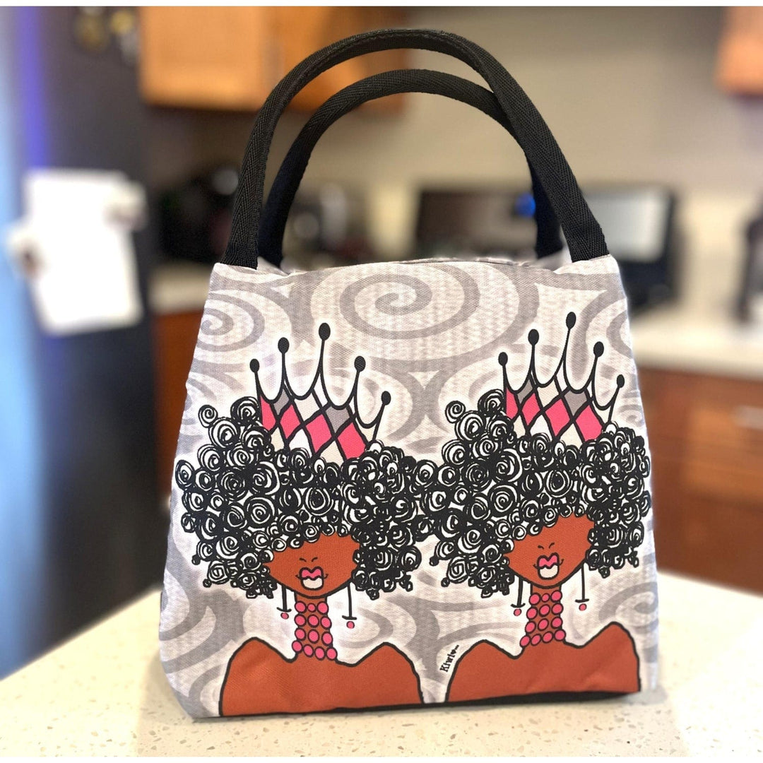 Kiwi McDowell's Crowns and Curls lunch bag with queens wearing pink crowns (Lifestyle)