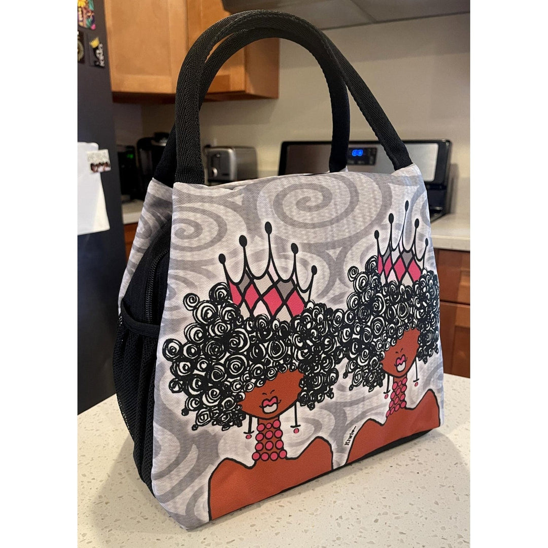 Kiwi McDowell's Crowns and Curls lunch bag with queens wearing pink crowns (Lifestyle 2)