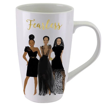 Fearless Ceramic Latte Mug by Nicholle Kobi (Front) - A white ceramic mug featuring a gold foil script that reads 'Fearless' above an illustration of three women in elegant black dresses, shown against a plain white background.