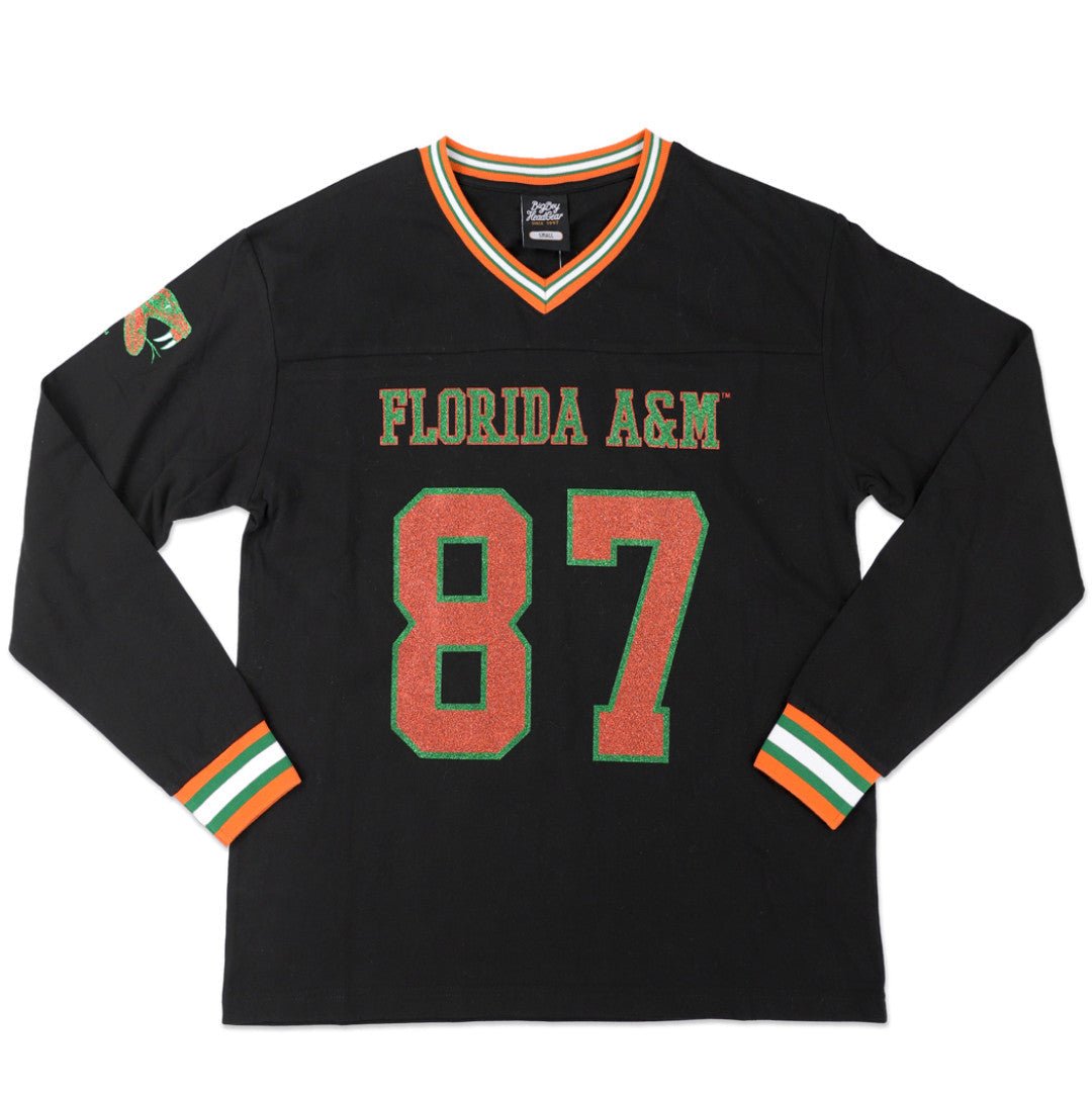 Florida A&M University Rattlers (FAMU) Long Sleeve Jersey Tee (Main) - A black long-sleeve Florida A&M hockey jersey with 'FLORIDA A&M' and the number '87' in orange with green outlines on the front, featuring orange, green, and white striped trim on the collar and cuffs.