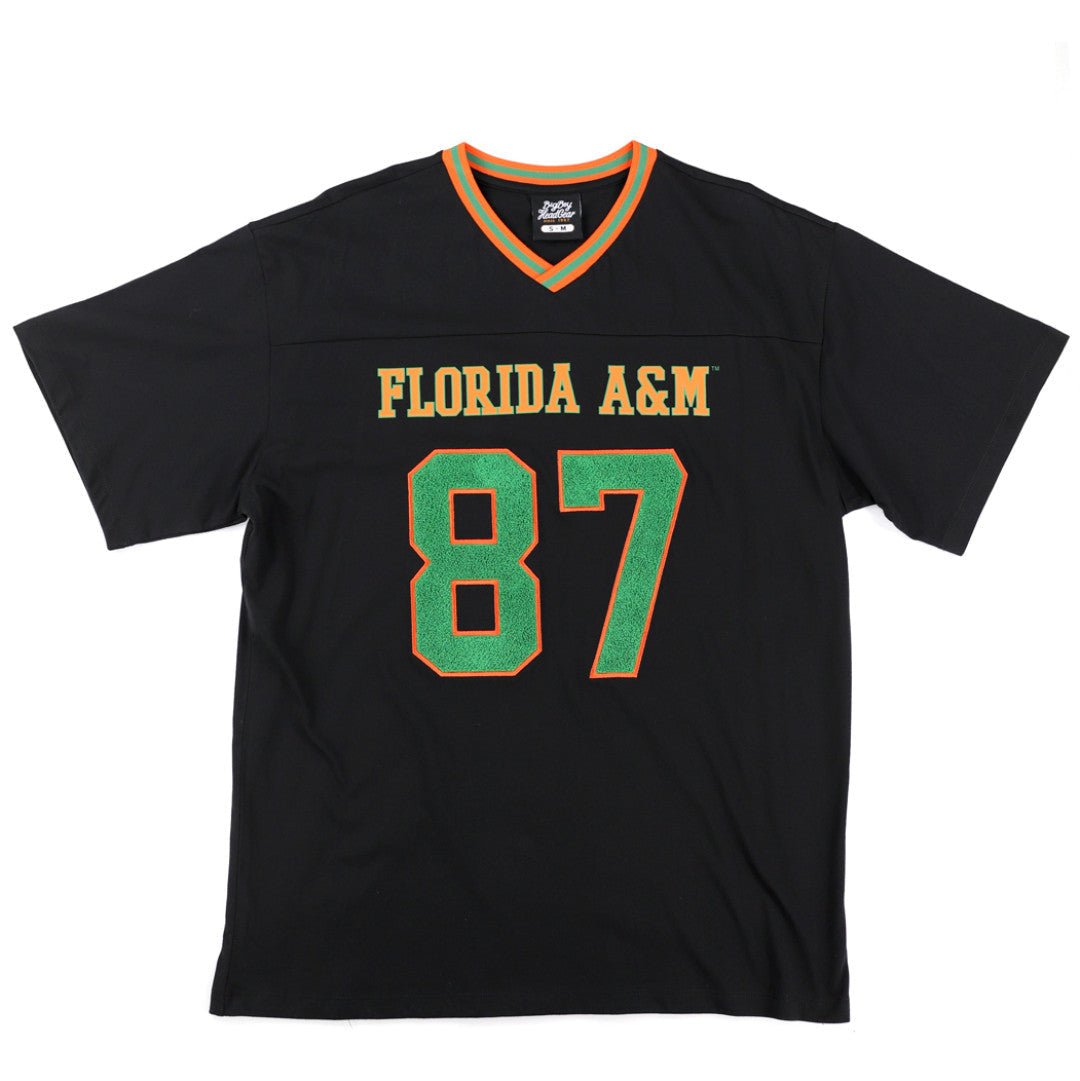 Florida A&M University Rattlers (FAMU) Oversized Jersey Tee (Main) - A black short-sleeve Florida A&M sports jersey with 'FLORIDA A&M' and the number '87' printed on the front in green and gold, displayed flat against a white background.