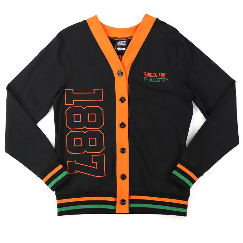 Florida A&M University Rattlers (FAMU) Women's Cardigan (Main) - A black varsity-style cardigan with bright orange trim, featuring '1887' in orange on the front, 'Turbin Air' and 'Nashville' embroidered on the chest, and orange and green striped accents on the cuffs and hem.