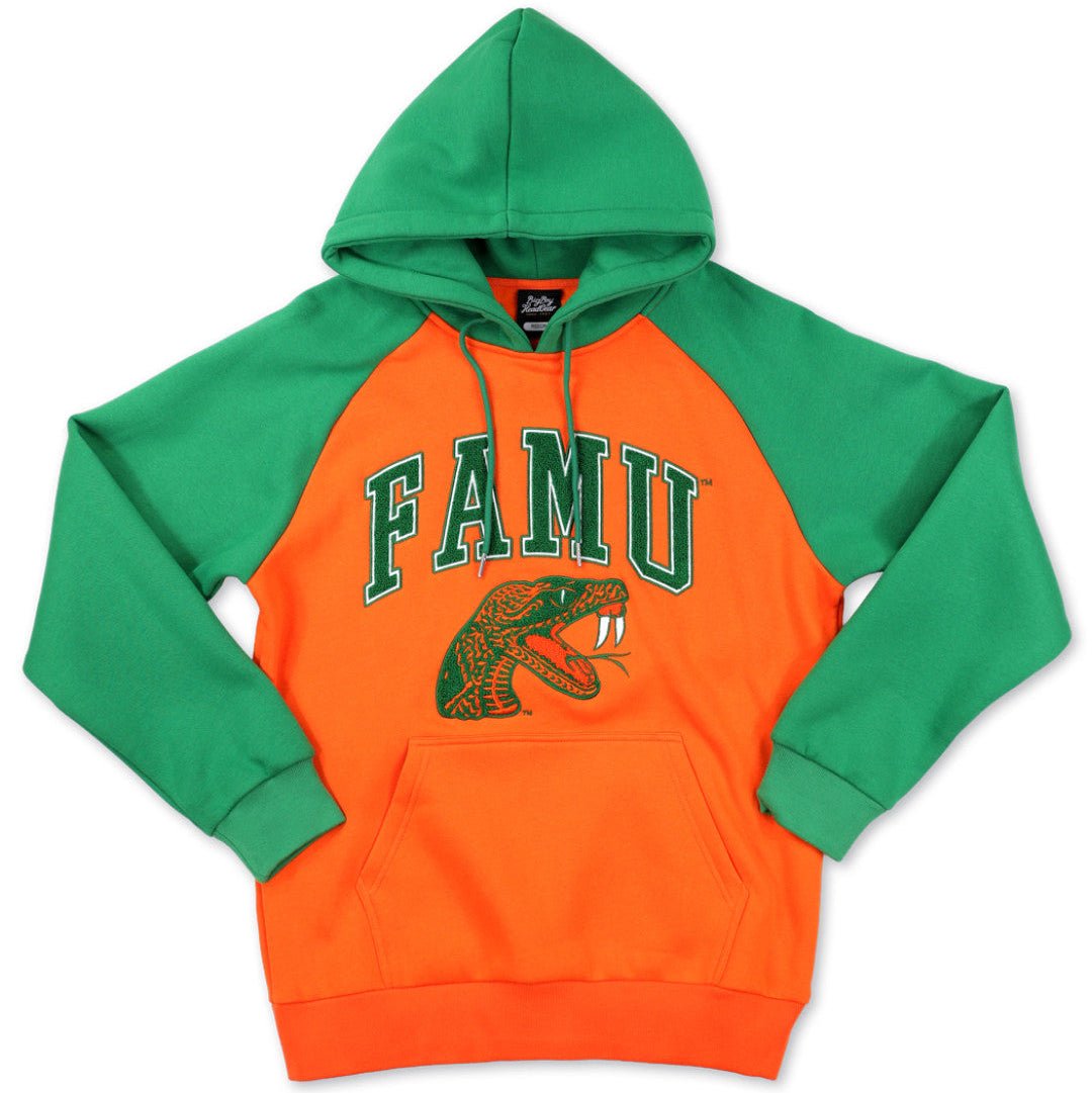 Florida A&M University (FAMU) Rattlers Hooded Sweatshirt (Main) - A two-tone pullover hoodie with bright green raglan sleeves and hood, and a vibrant orange body. The front features 'FAMU' in green varsity lettering with a green snake graphic underneath.