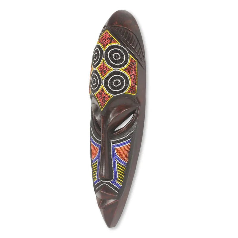 Ga Warrior (Asafoatse) African Mask (Side) - Angled view of handcarved sese wood Ga mask with colorful glass beadwork