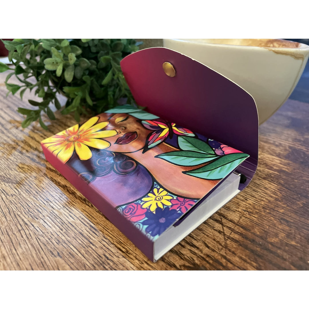 Garden Spirit: African American Stylus Purse Pal by Pamela Hills (Lifestyle 2) - Colorful card with a floral design on a wooden surface