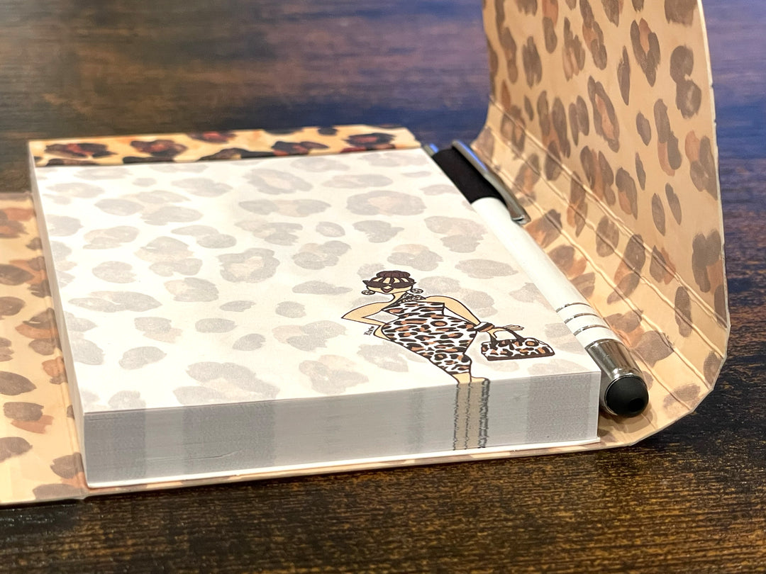Goddess Vibes: African American Stylus Purse Pal by Kiwi McDowell (Lifestyle) - Notebook with leopard print cover and pen on a wooden surface