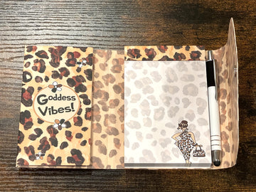 Goddess Vibes: African American Stylus Purse Pal by Kiwi McDowell (Interior) - Notebook with leopard print cover and 'Goddess Vibes!' text, open to a page with a woman illustration on a wooden surface.