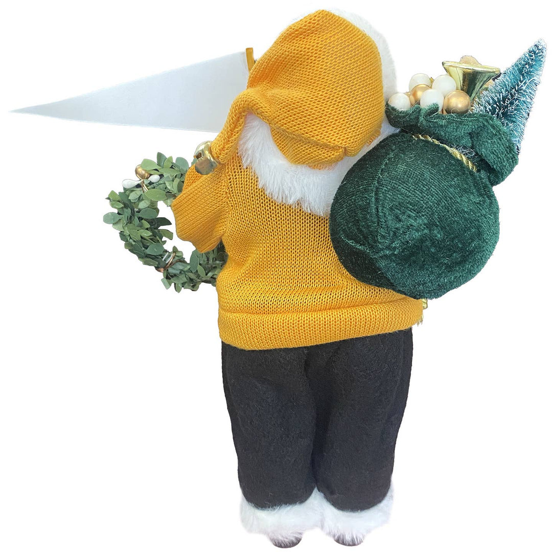 Rear view of Grambling Santa figurine with gold sweater and black pants