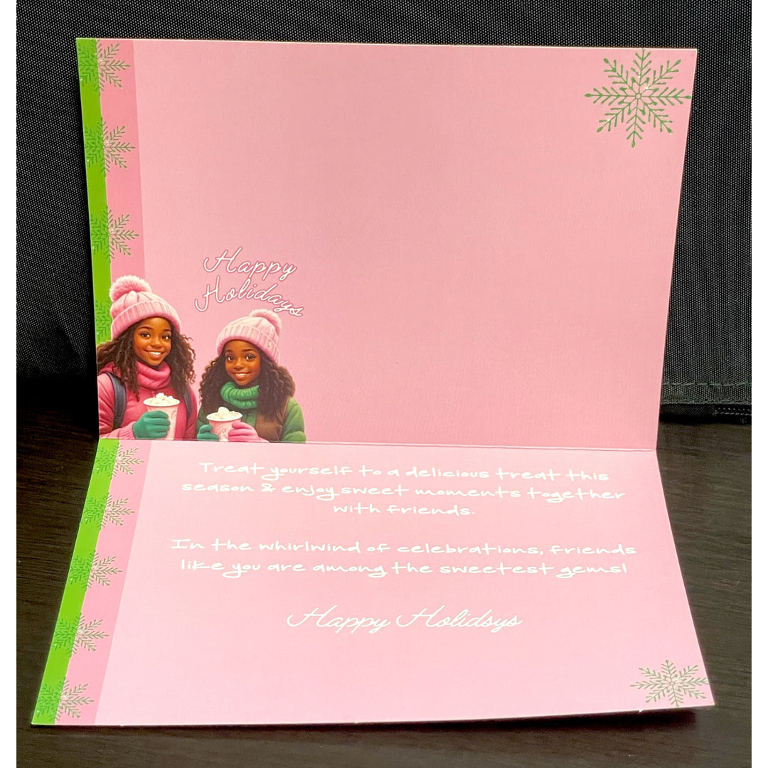 Holiday Vibes (Ivy Edition): African American Christmas Card Box Set (Lifestyle, Interior) - Pink holiday card with two people and a snowflake design on a dark surface