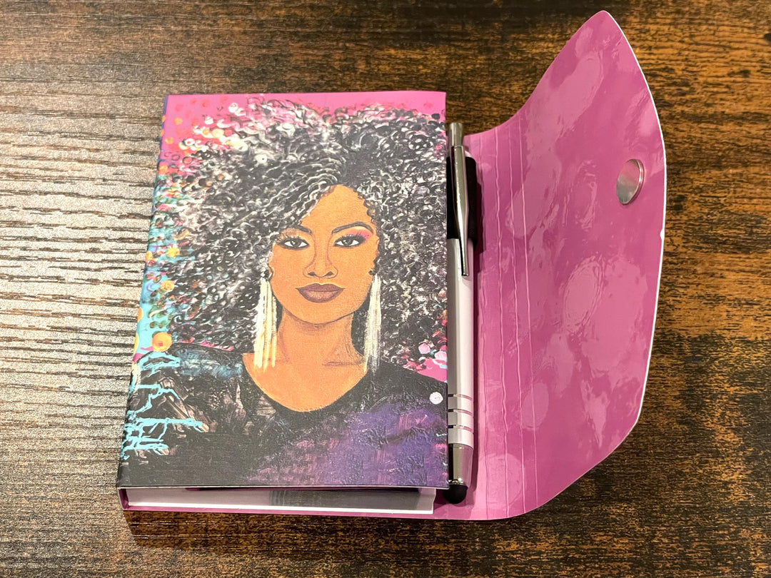 I am Everything: African American Stylus Purse Pal by Sylvia "Gbaby" Cohen (Lifestyle) - Notebook with a colorful portrait on the cover and a pink cover on a wooden surface
