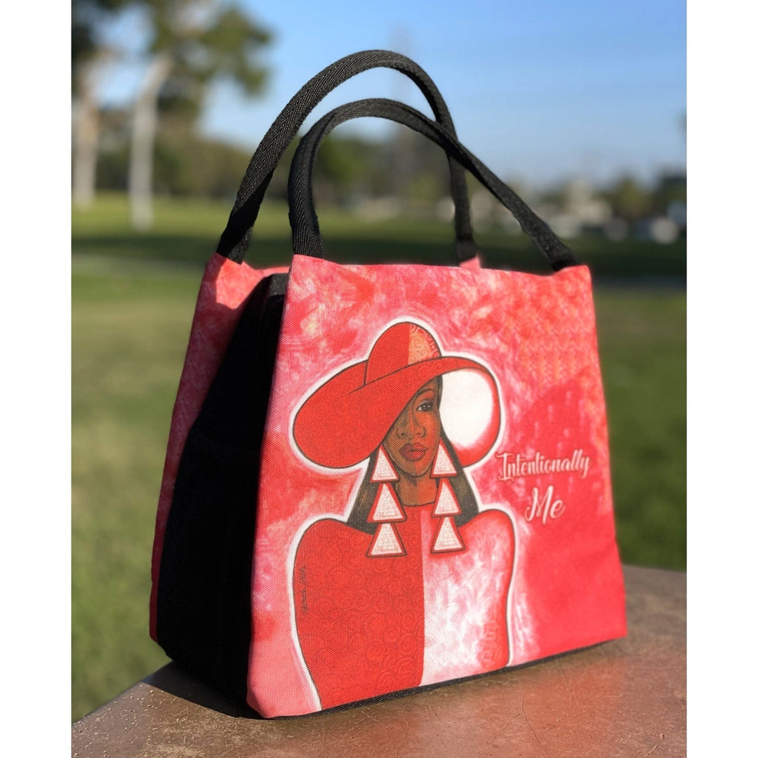 Pamela Hills' Intentionally Me Crimson lunch bag with woman in red hat design (Lifestyle 2)