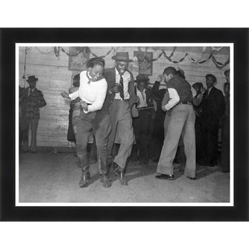 Jitterbug Juke Joint 1939 by Marion Post Wolcott (Black Frame) - Two men dancing in a room with other people in the background, framed photo