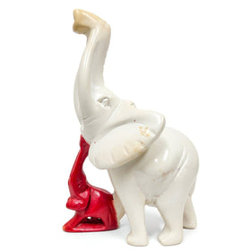 Leading the Way: Legacy and Leadership Elephant Soapstone Sculpture (Main) - White elephant figurine with a red object on a white background (Delta Sigma Theta Gift)