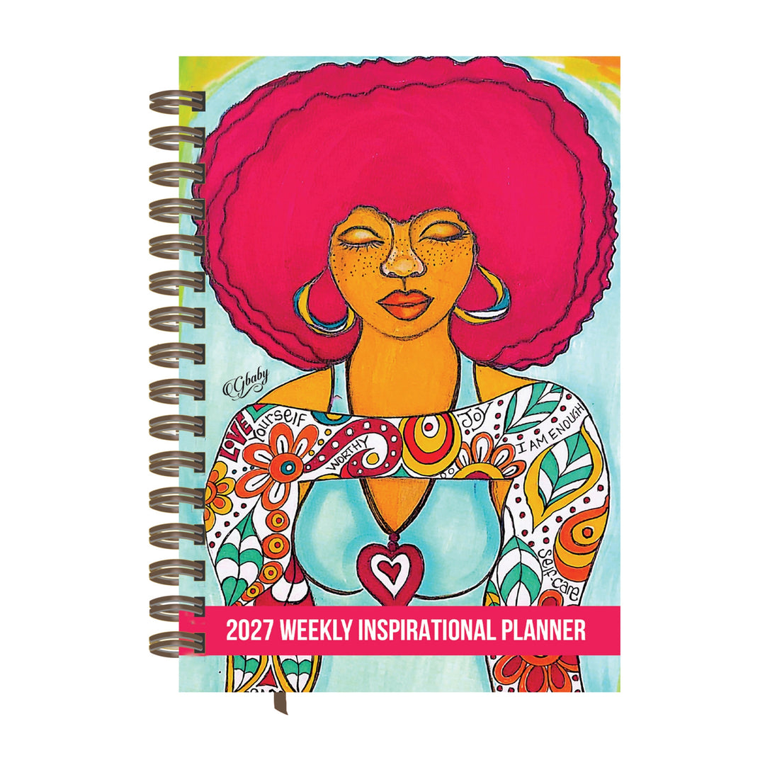 Love Yourself 2027 Weekly Inspirational Planner by Sylvia "Gbaby" Cohen (Main) - A spiral-bound 2027 weekly inspirational planner featuring a colorful illustration of a woman with a bright pink afro hairstyle on the cover, set against a plain white background.