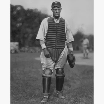 Louis Santop: Big Bertha by Omari Dixon - Black and white photograph of a vintage baseball catcher on a field
