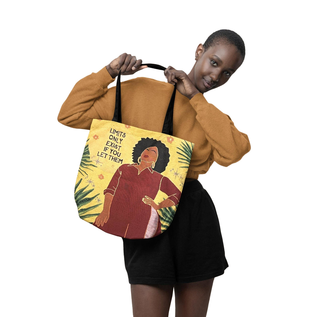No Limits: African American Woven Tote Bag by Janine Robinson (Lifestyle 4) - Person holding a tote bag with a design of a woman and text on a white background