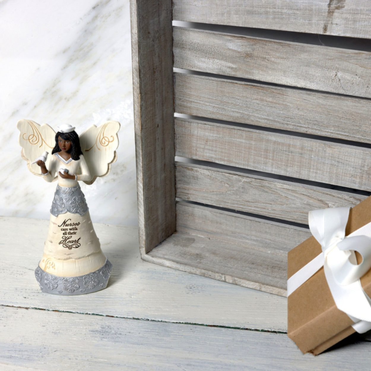 7 of 9: Nurses Care Angel Figurine: Ebony Elements Collection by Pavilion Gifts (Lifestyle Photo)