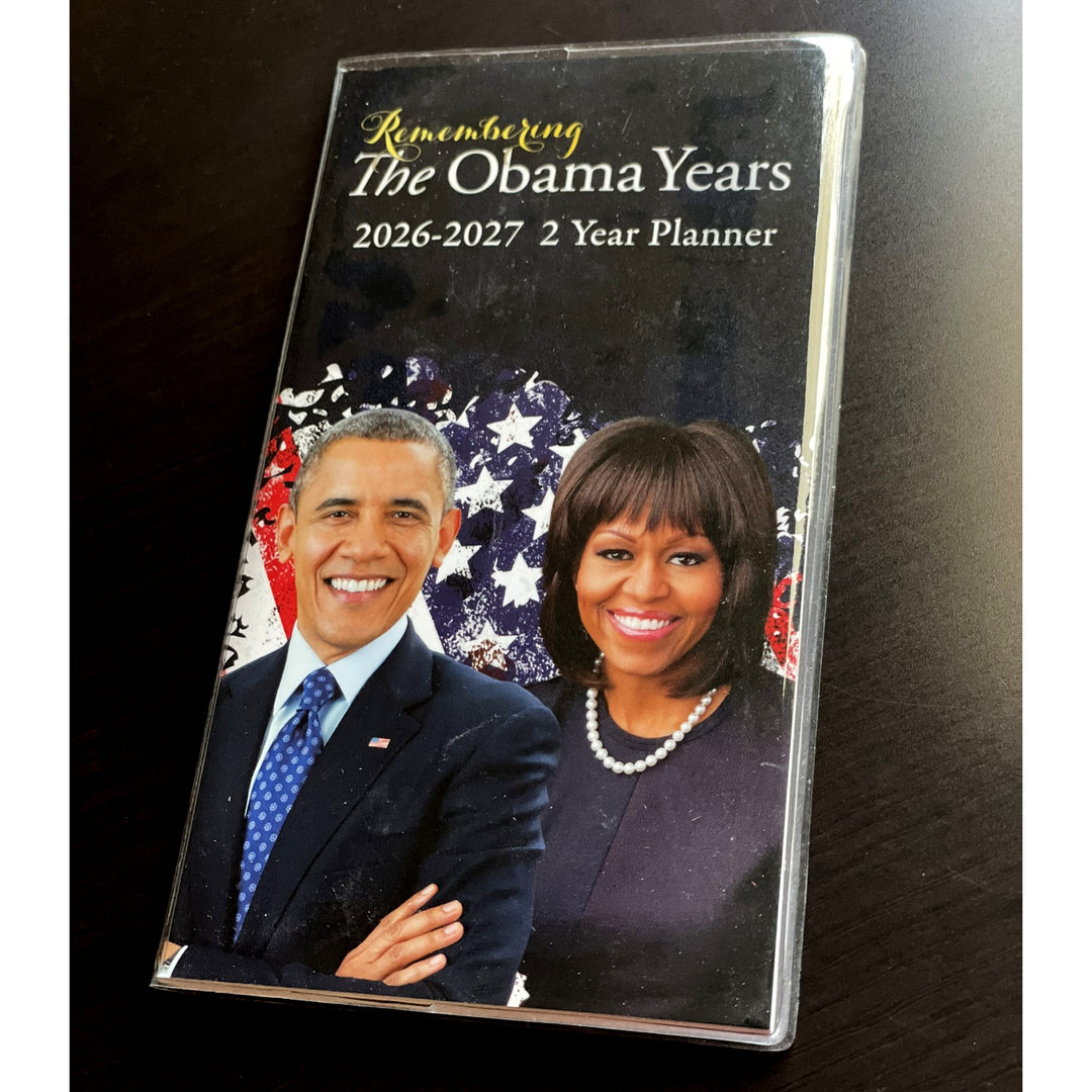 Remembering The Obamas: 2026-2027 Commemorative Two Year African American Planner (Lifestyle Photo 2) - Planner cover featuring images of a man and a woman with text 'Remembering The Obama Years 2026-2027 2 Year Planner'.
