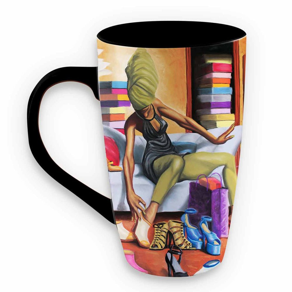 Shoe Addict Ceramic Latte Mug by Dion Pollard (Front) - A tall ceramic mug with a black handle and black interior, featuring a colorful printed illustration of a woman sitting on a couch in a room with shelves of books and shoes scattered on the floor.