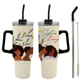 Sister Strong by Janine Robinson: African American 40 Ounce Tumbler with Handle (Main) - Two insulated tumbler cups with black handles and straws are shown on a white background, along with a metal cleaning brush. The tumblers have a cream-colored body with a graphic of two Black women, yellow flowers, green leaves, and the words 'Sister Strong' in green and red script.