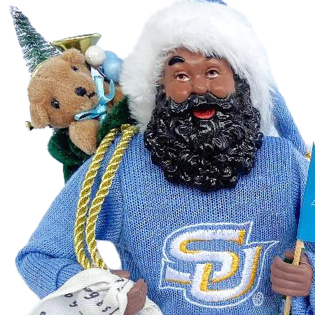 Close-up of Southern Santa face, curly beard and gold SU logo sweater